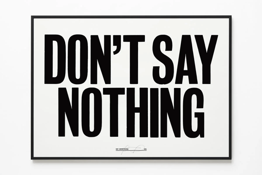 A black and white print (wall art) with the word HOPE written in large text, signed by Anthony Burrill.