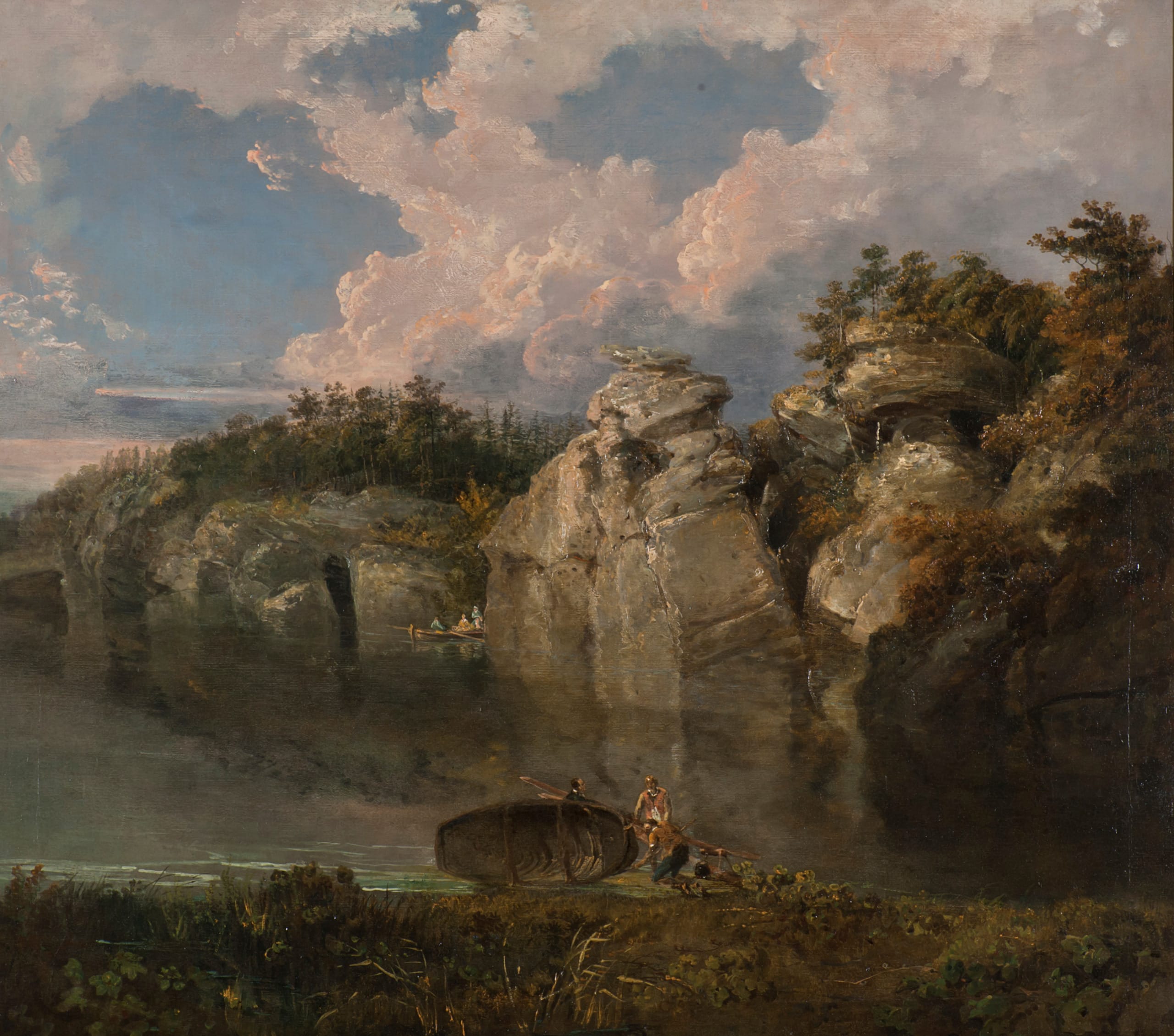 An oil painting showing a rocky cliff behind a large lake. A small fishing boat with three people can be seen drifting between a gap in rocks. The sky is bright blue but with gathering clouds to the right. In the front centre, three men stand next to a fishing boat on it's side on the banks of the lake.