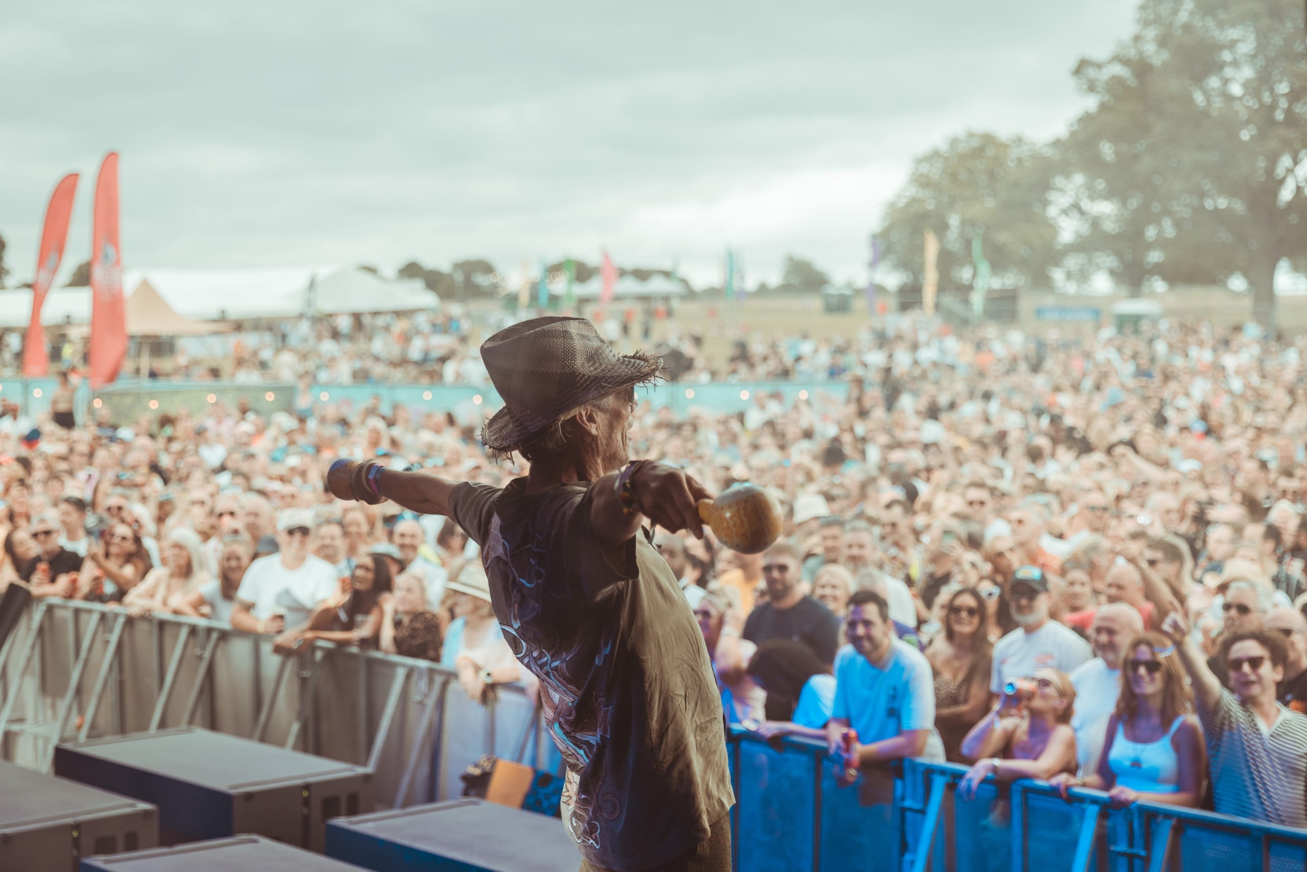 Bez from the Happy Mondays performs in front of a large crowd at Goodlife Festival.